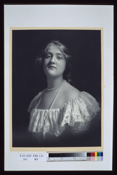 A woman wearing a long natural pearl necklace, c.1900 — the era when natural pearls commanded extraordinary prices