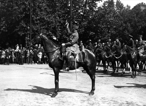 Marshal Ferdinand Foch saluting with his marshal's baton on horseback at the Bastille Day victory parade, 14 July 1919